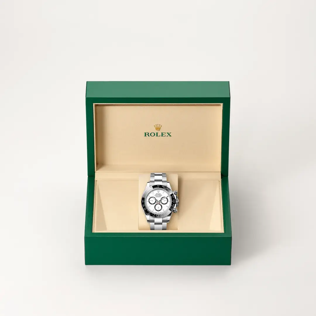 The Rolex Cosmograph Daytona presented in its green Rolex box